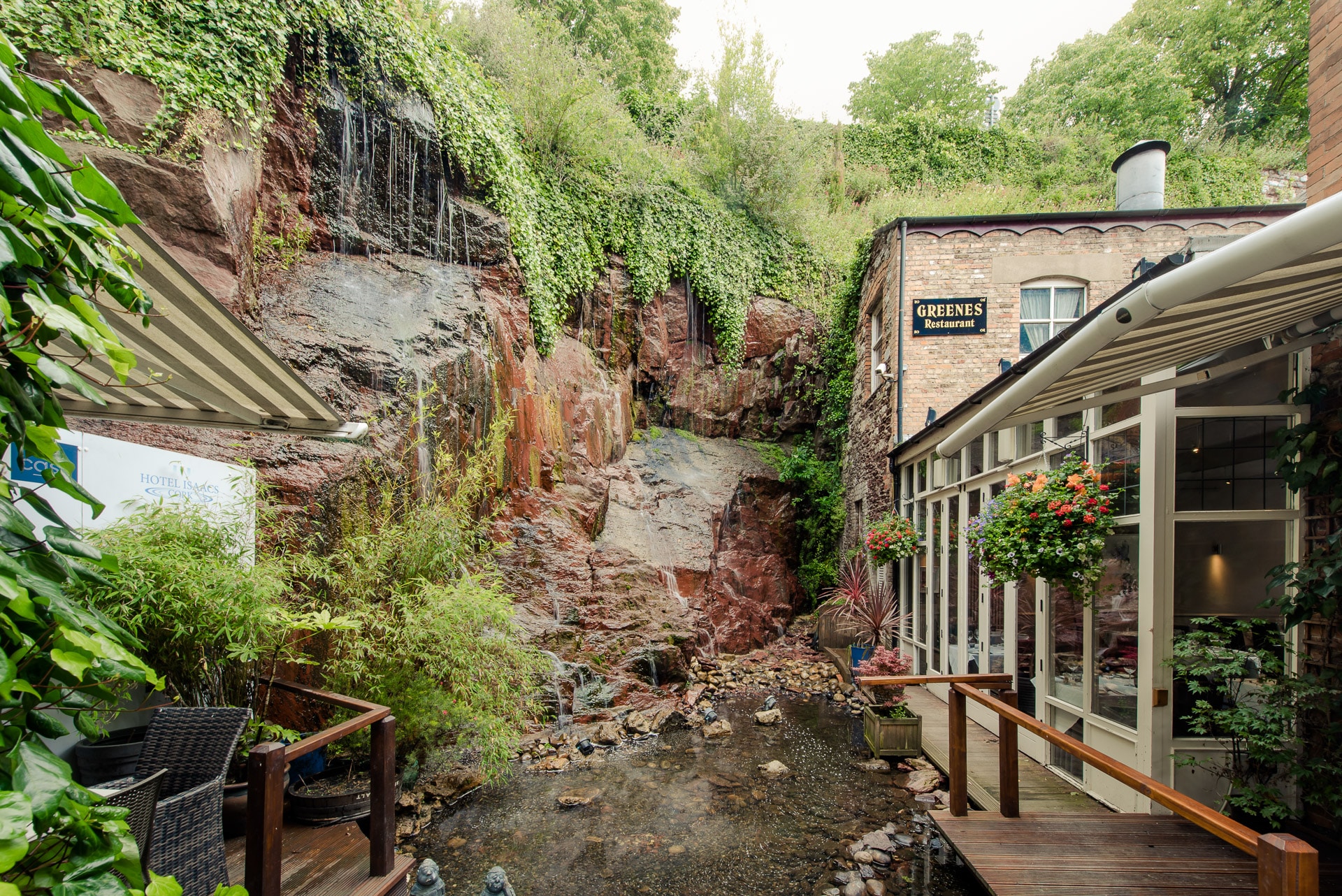 Hotel Isaacs Cork outdoor eating with view oof waterfall